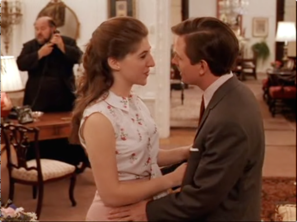 Maym Bialik and Michael J fox in Don't Drink the Water (DeLuise in the background)
